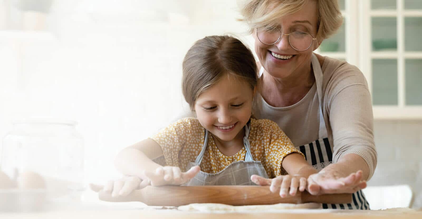 Older woman and young girl baking