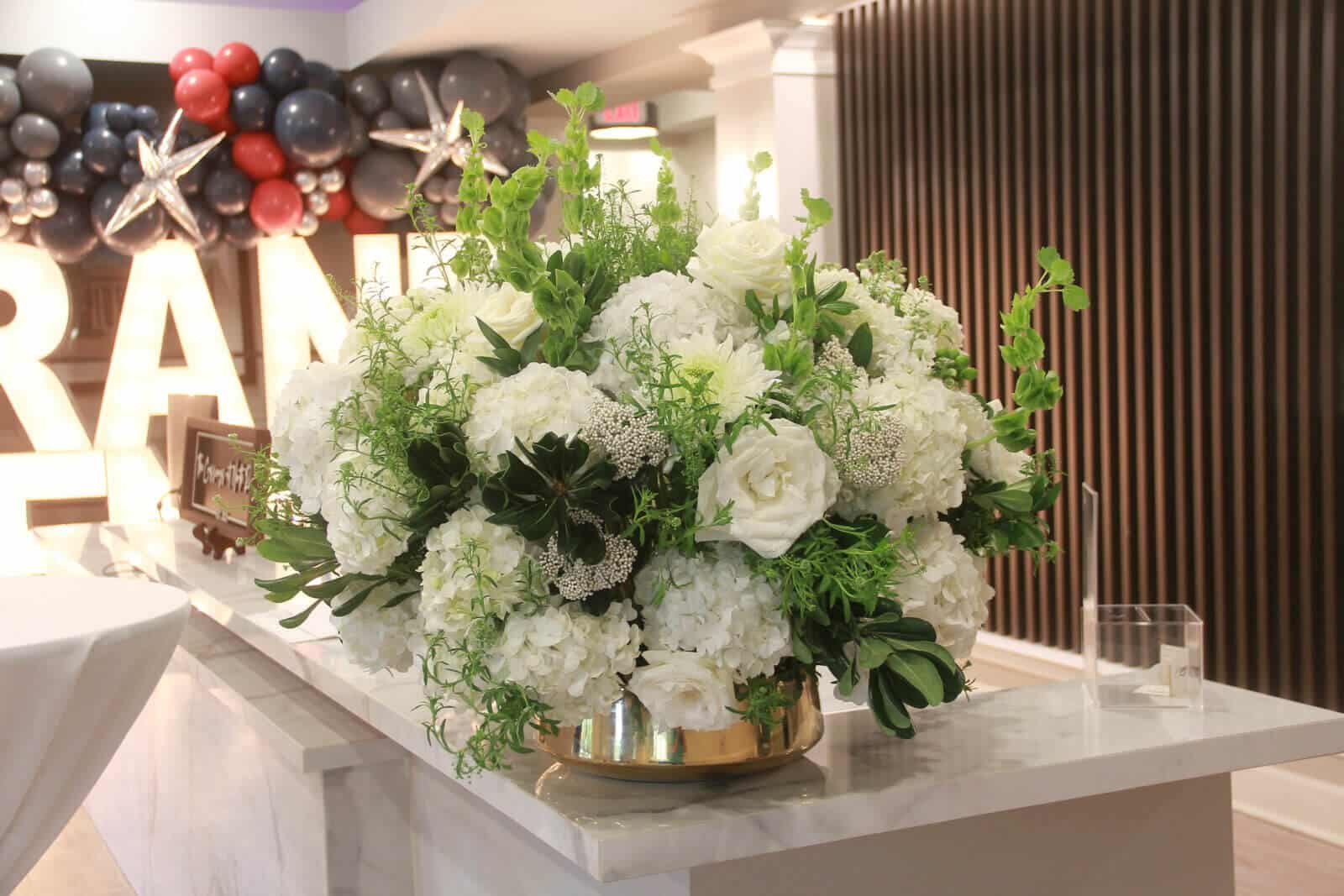 arrangement of white flowers at the grand opening at The Crossings at North River