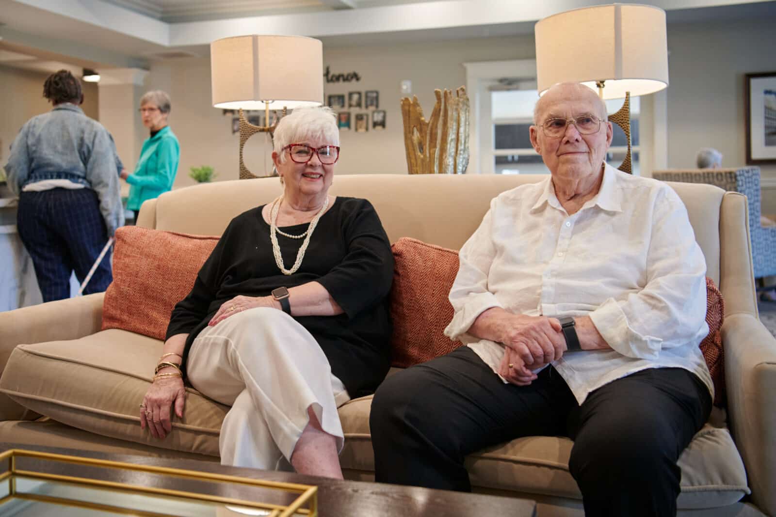elder couple sitting on a couch