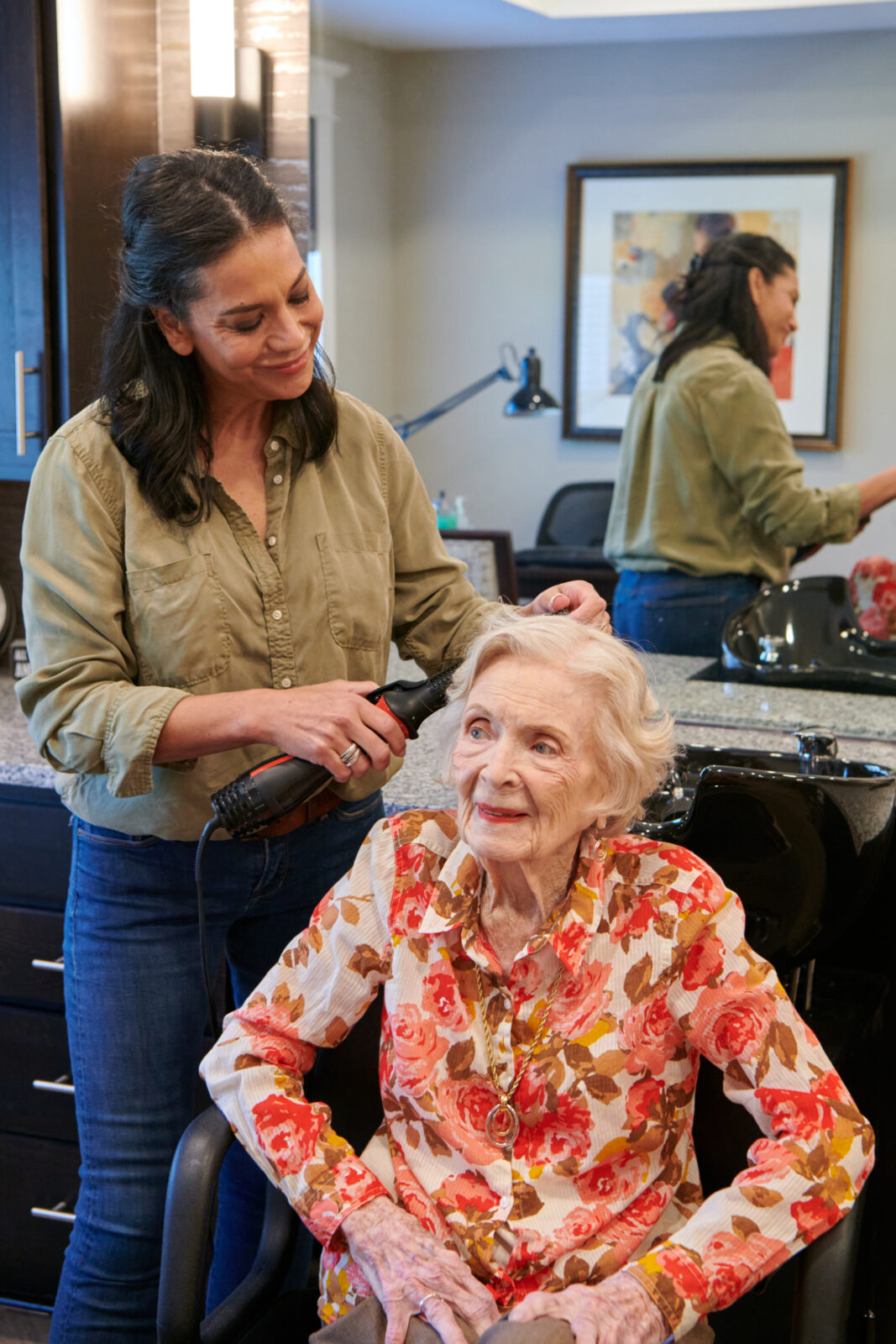 resident getting her hair styled at the salon at The Crossings at North River