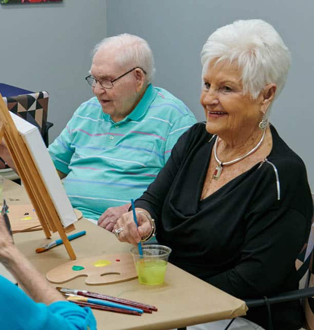 elder couple enjoying some arts and crafts time